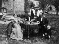 Rev. Homme sits with his family